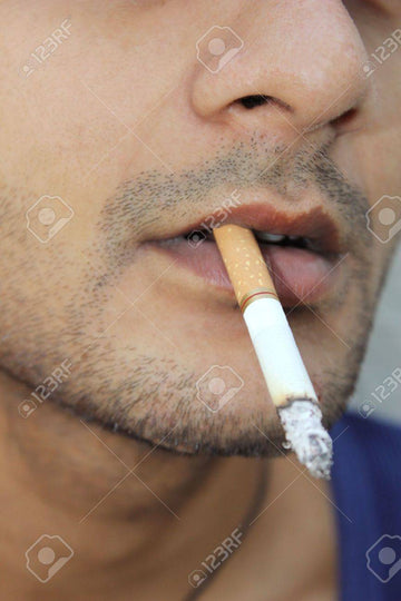 Close-up Shot Of A Guy With Cigarette In His Mouth Stock Photo, Picture and  Royalty Free Image. Image 13262401