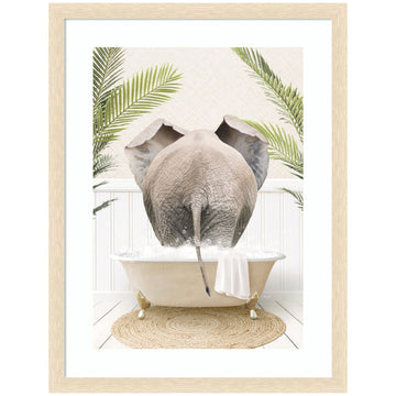 Elephant back in a palm bathtub framed wall art print for a bathroom