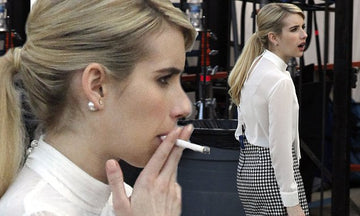 Emma Roberts puffs on a cigarette between filming scenes for Scream Queens  in New Orleans