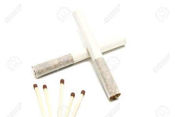 Two Cigarettes Without Filter And Few Matches On White Stock Photo, Picture  and Royalty Free Image. Image 38671807