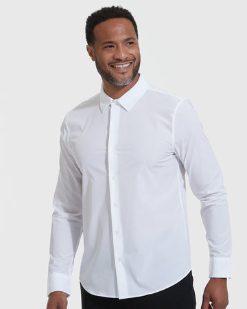 White Lightweight Dress Shirt worn by smiling male model against gray backdrop.