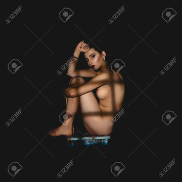 Sexy Girl Without Clothes With Shadows On Her Body Sits On A Chair And  Looking At The Camera In Studi On Black Background Stock Photo, Picture and  Royalty Free Image. Image 62380774