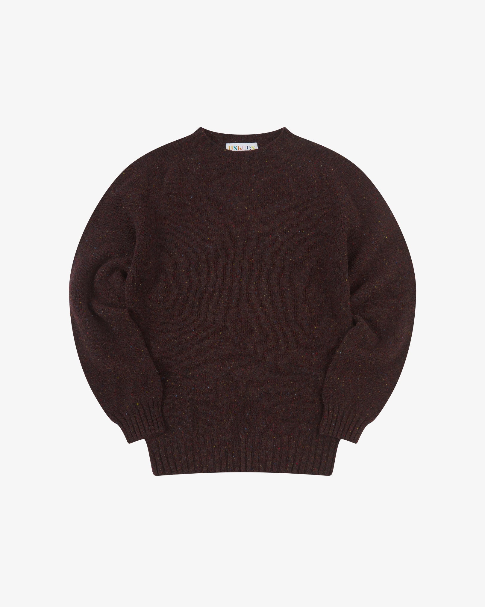 Front flat view of brown speckled walnut, Alderney crew neck jumper in Scottish new wool. Clear view of drop shoulder design Uskees branding label.