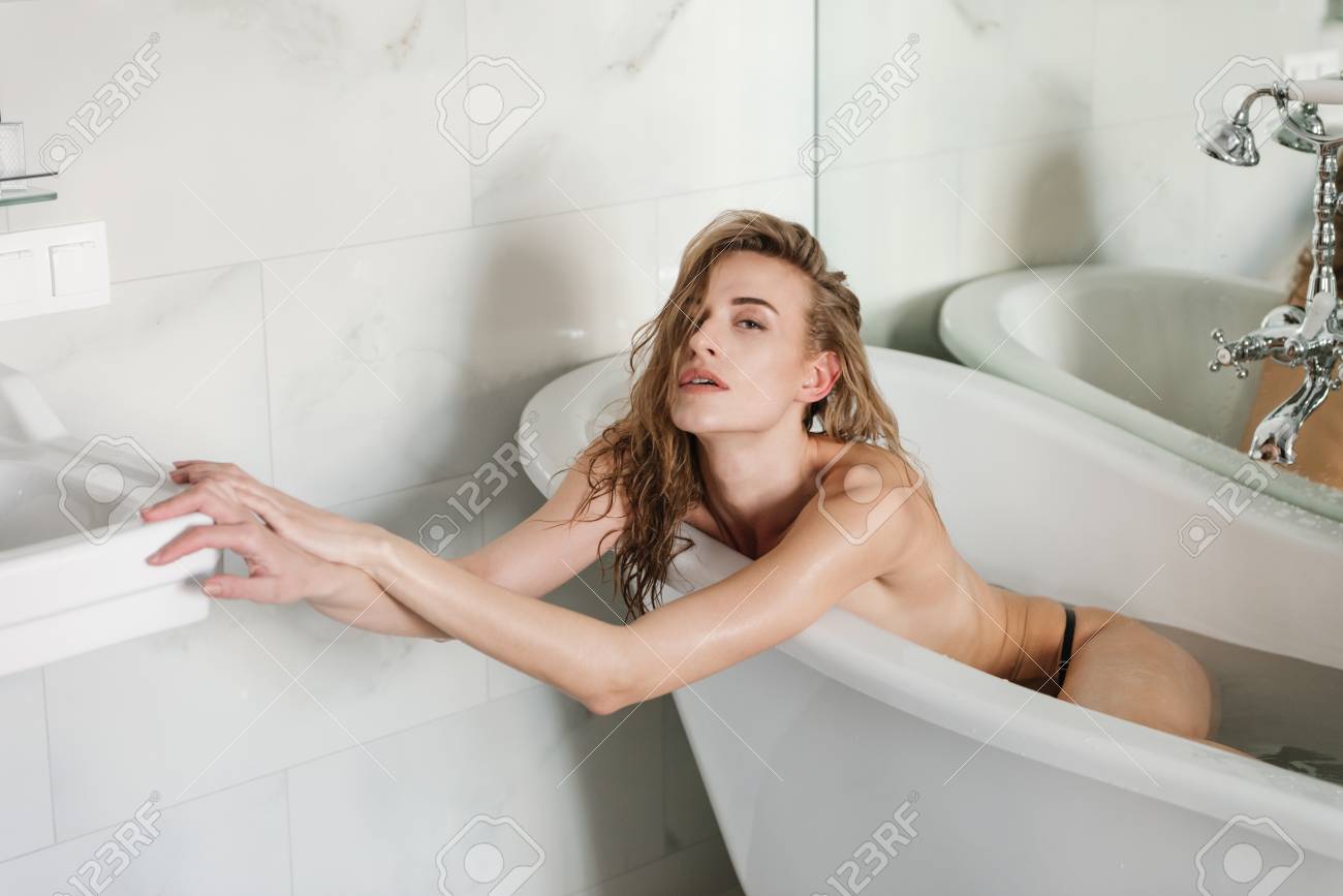 Young Woman Without Clothes Lying In Bath With Water Stock Photo, Picture  and Royalty Free Image. Image 78672943