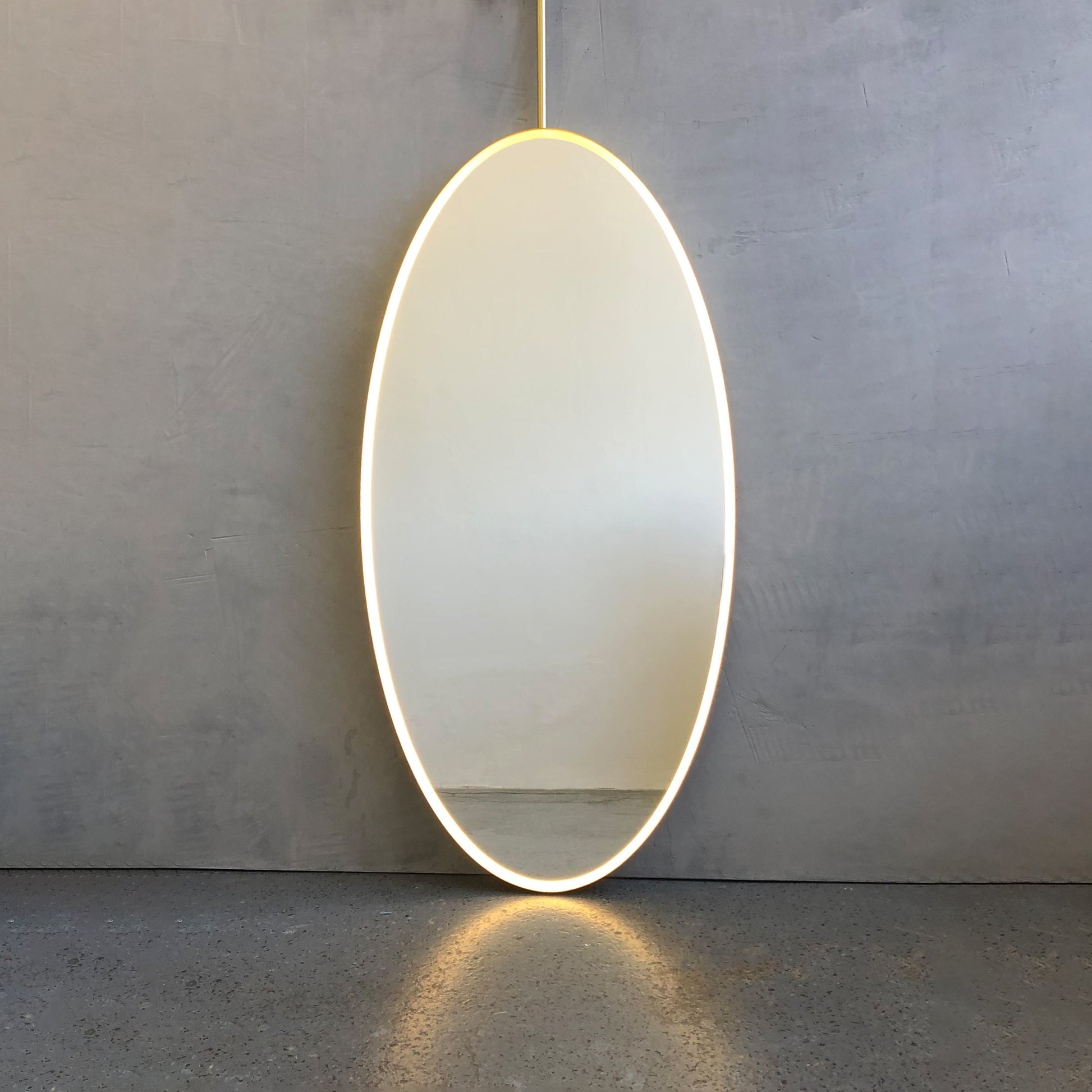 Illuminated Ceiling Suspended Contemporary Oval Mirror with a Brass Frame