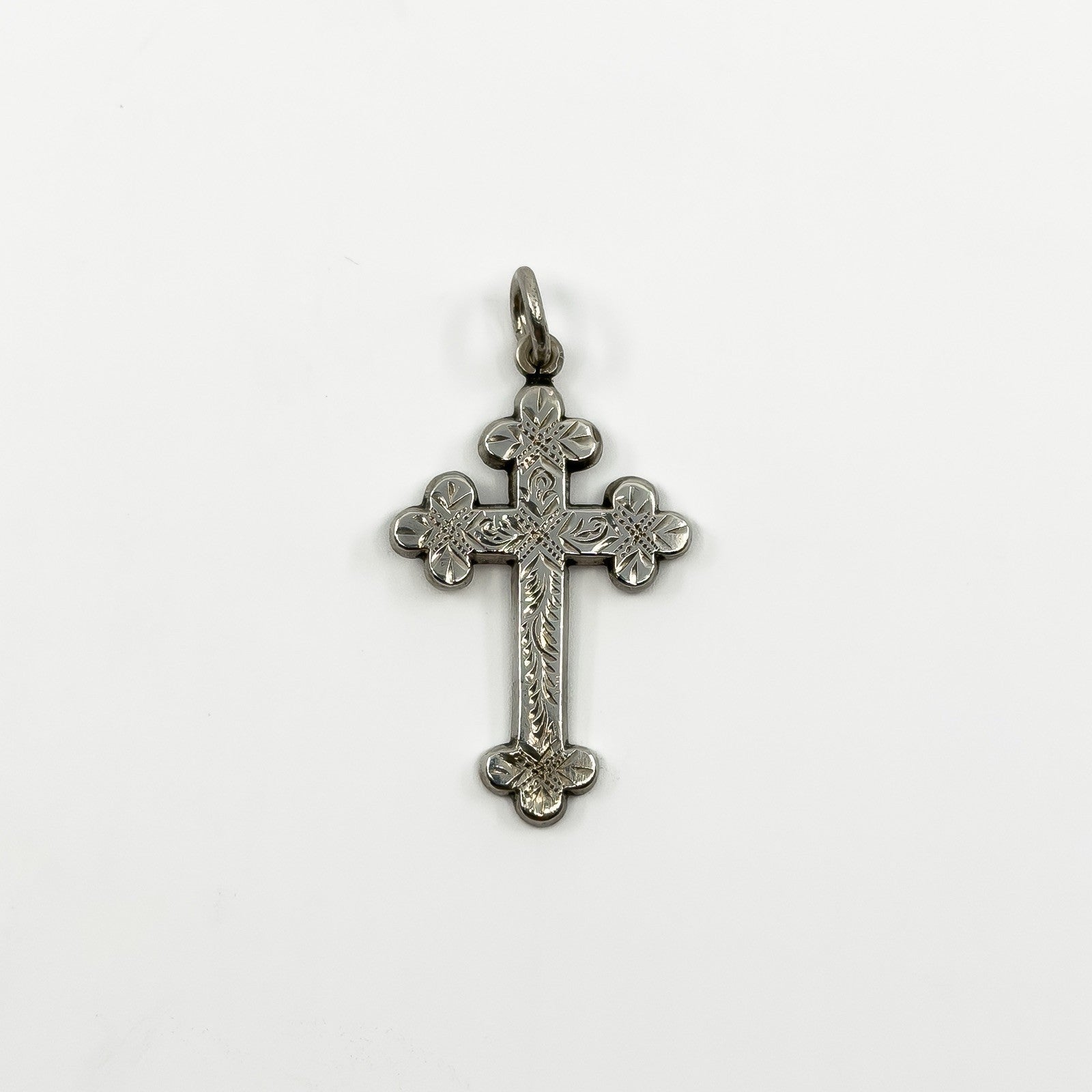 Antique Victorian sterling silver engraved cross pendant with floral detailing and large bail