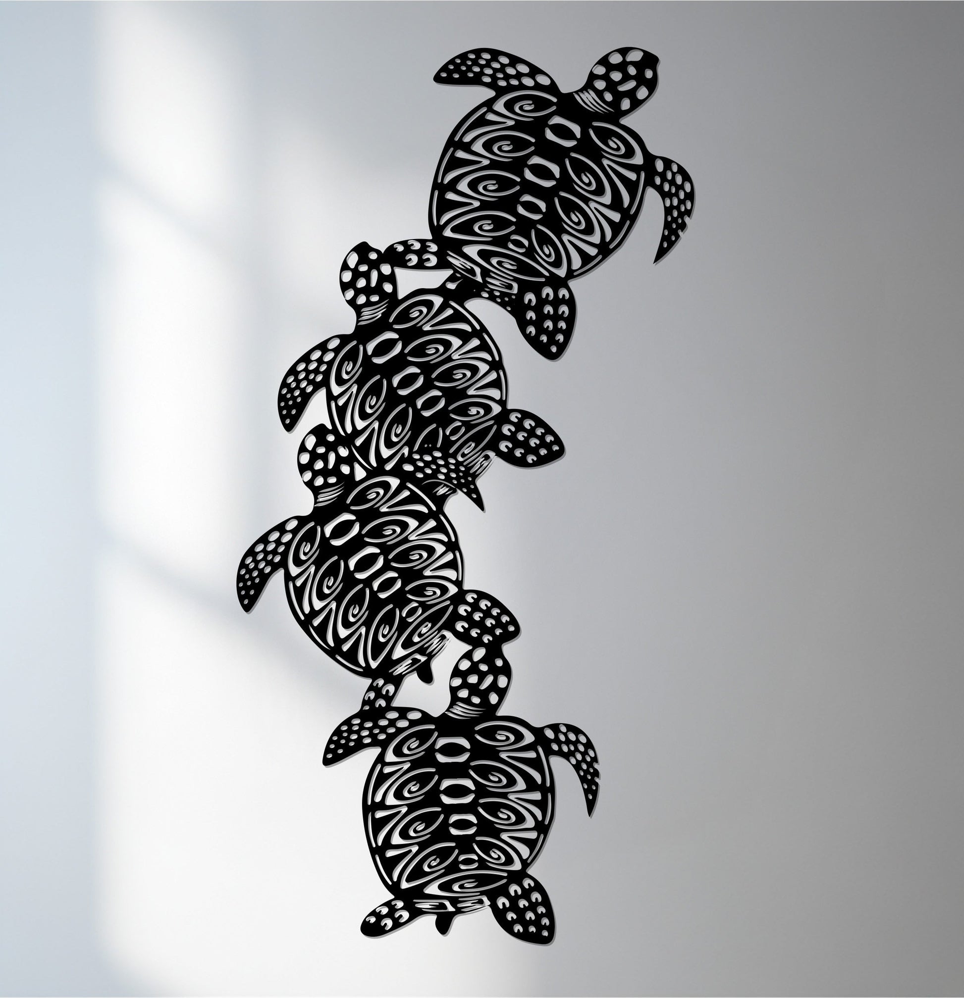 Delicate organic forms compose these sea turtle metal wall art, presenting a tribal ocean design that offers unique metal wall art with interwoven shapes.