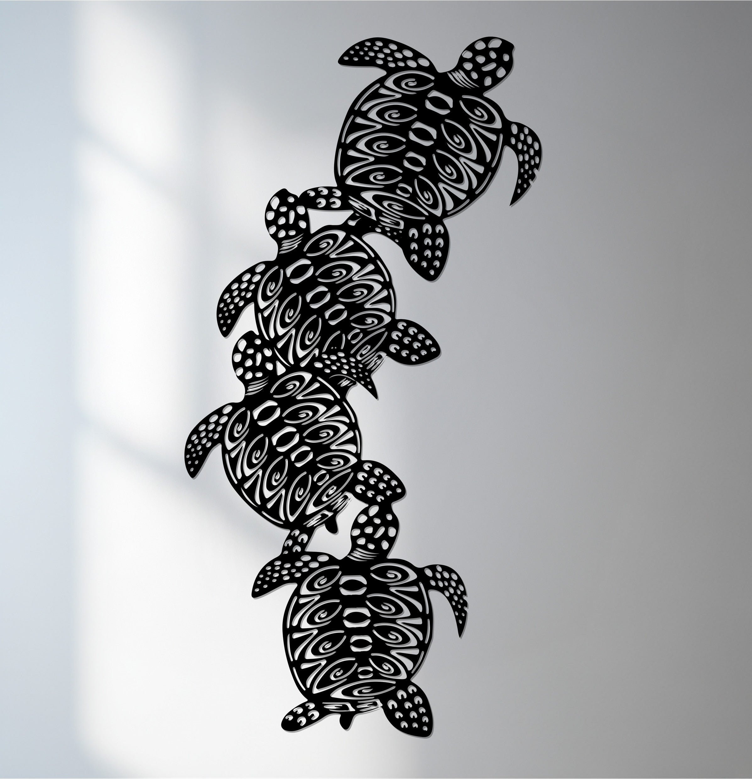 Delicate organic forms compose these sea turtle metal wall art, presenting a tribal ocean design that offers unique metal wall art with interwoven shapes.