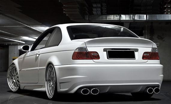 BMW 3 Series E46 Coupe rear bumper in white, designed with a clean sporty style and dual twin exhaust cutouts for an aggressive performance look.