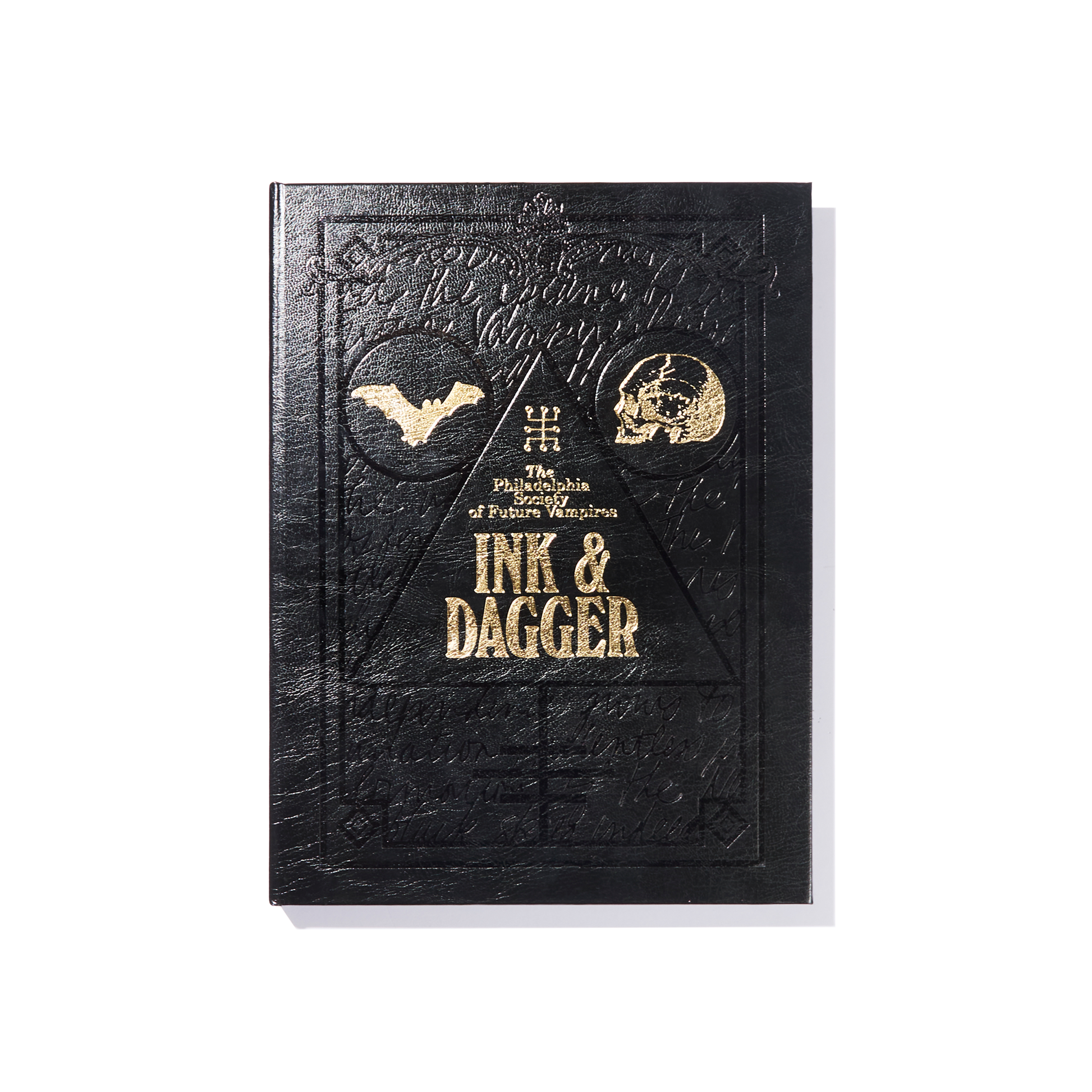 A black embossed book cover with gold text reading The Philadelphia Ed. of Future Weapons by Ink & Dagger, featuring a bat, a skull, and geometric designs—this limited edition volume from Ink & Dagger is truly The Almighty book for collectors and fans alike.