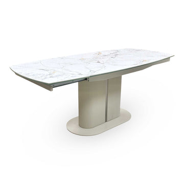 Full view ‘Avorio’ contemporary dining table, showcasing a luxury ceramic top and architectural metal base frame in its standard compact configuration.