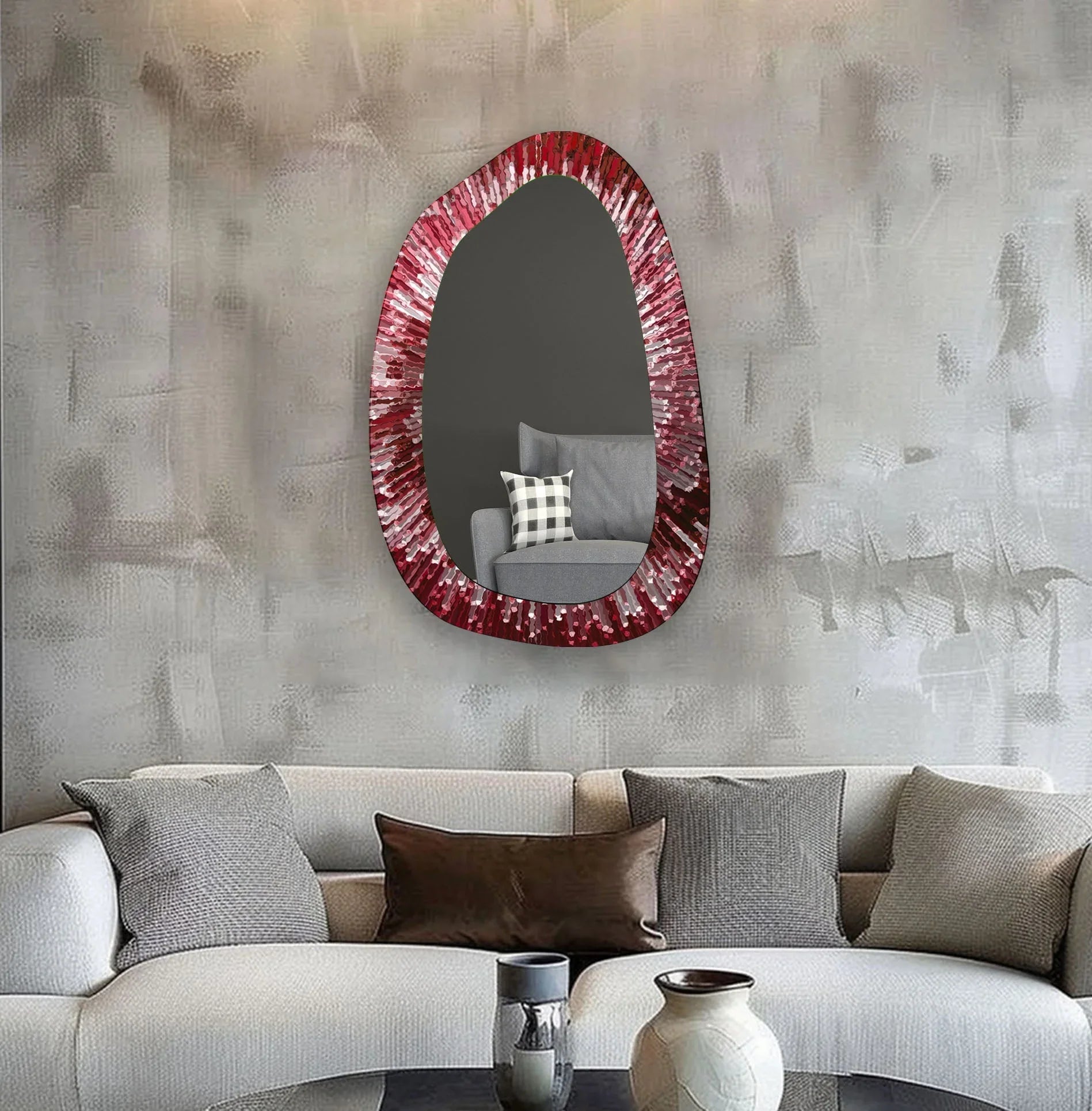 Realistic detail shows the red abstract entryway wall mirror with its irregular frame reflecting a nearby chair, enhancing its role as a distinctive bathroom mirror.
