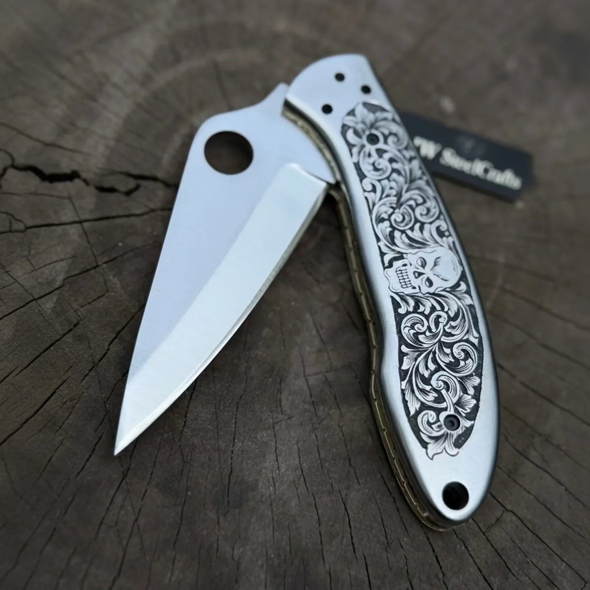Hand Engraved D2 Steel Folding Pocket Knife — Mirror Polished Leaf Blade, Skull Floral Scroll Stainless Handle