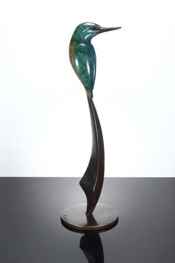 Elegant bronze sculpture of a stylised kingfisher perched on a tall, curved base. The bird features a vivid patina in shades of emerald green and turquoise, with a rich brown lower half and dark bronze beak, all finished with a lustrous polish.