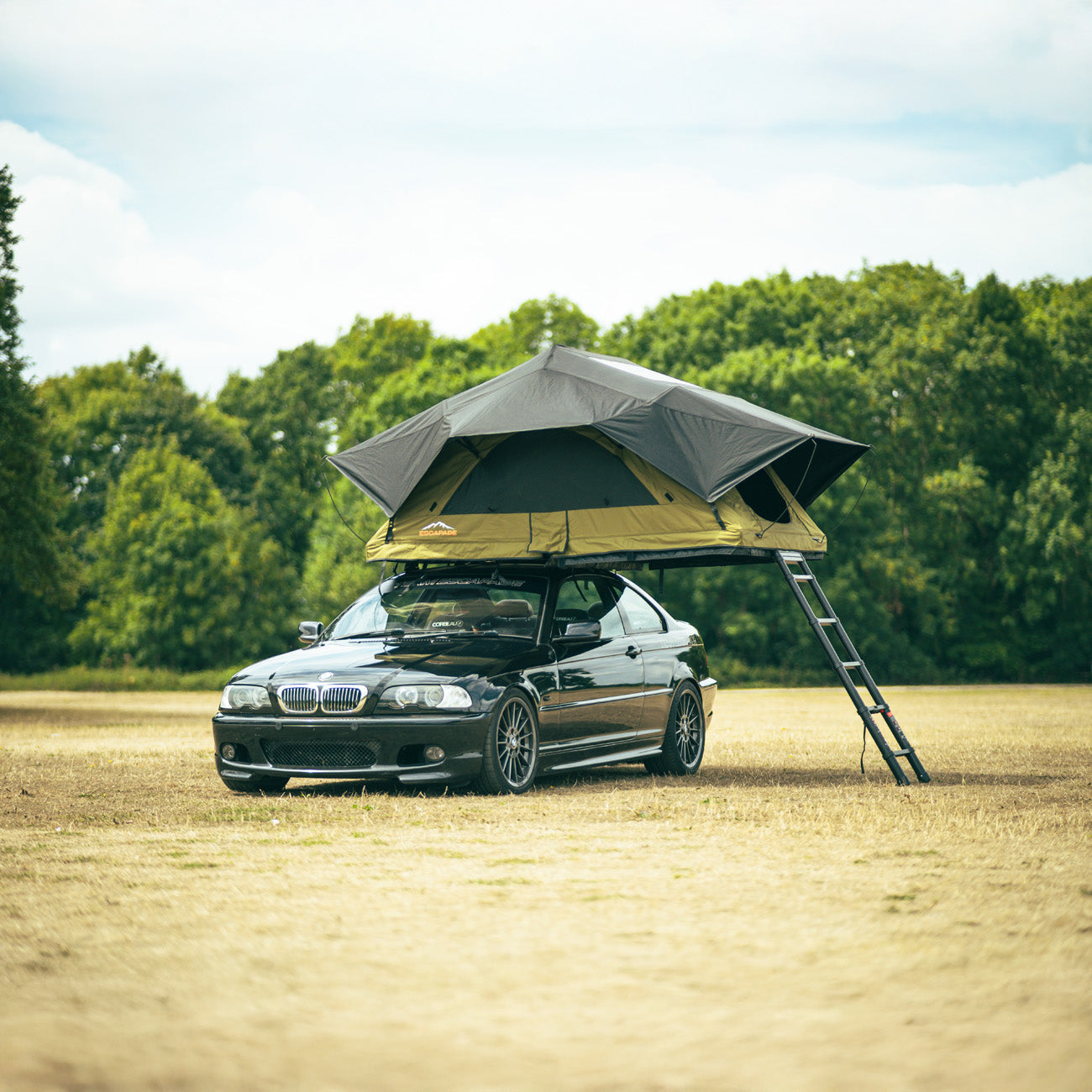 Escapade Summit softshell rooftop tent open on vehicle at UK campsite