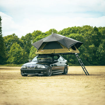 Escapade Summit softshell rooftop tent open on vehicle at UK campsite