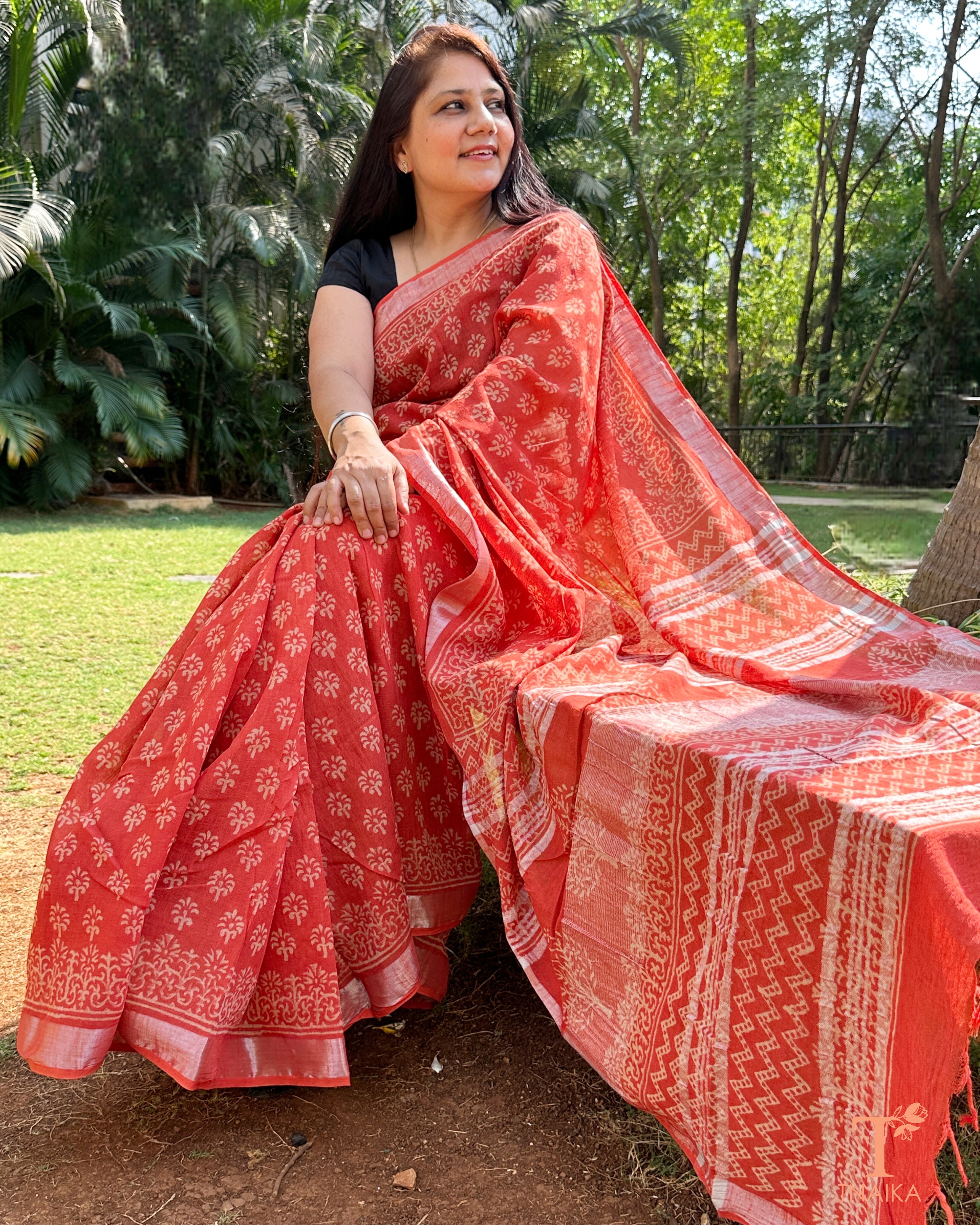 coral red linen cotton slub saree with traditional motifs Tnaika