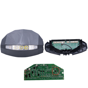Internal components of the KuKirin G2 display dashboard, showing the aerodynamic headlight housing, the internal mounting frame, and the main green printed circuit board (PCB) with electrical integrated circuits.