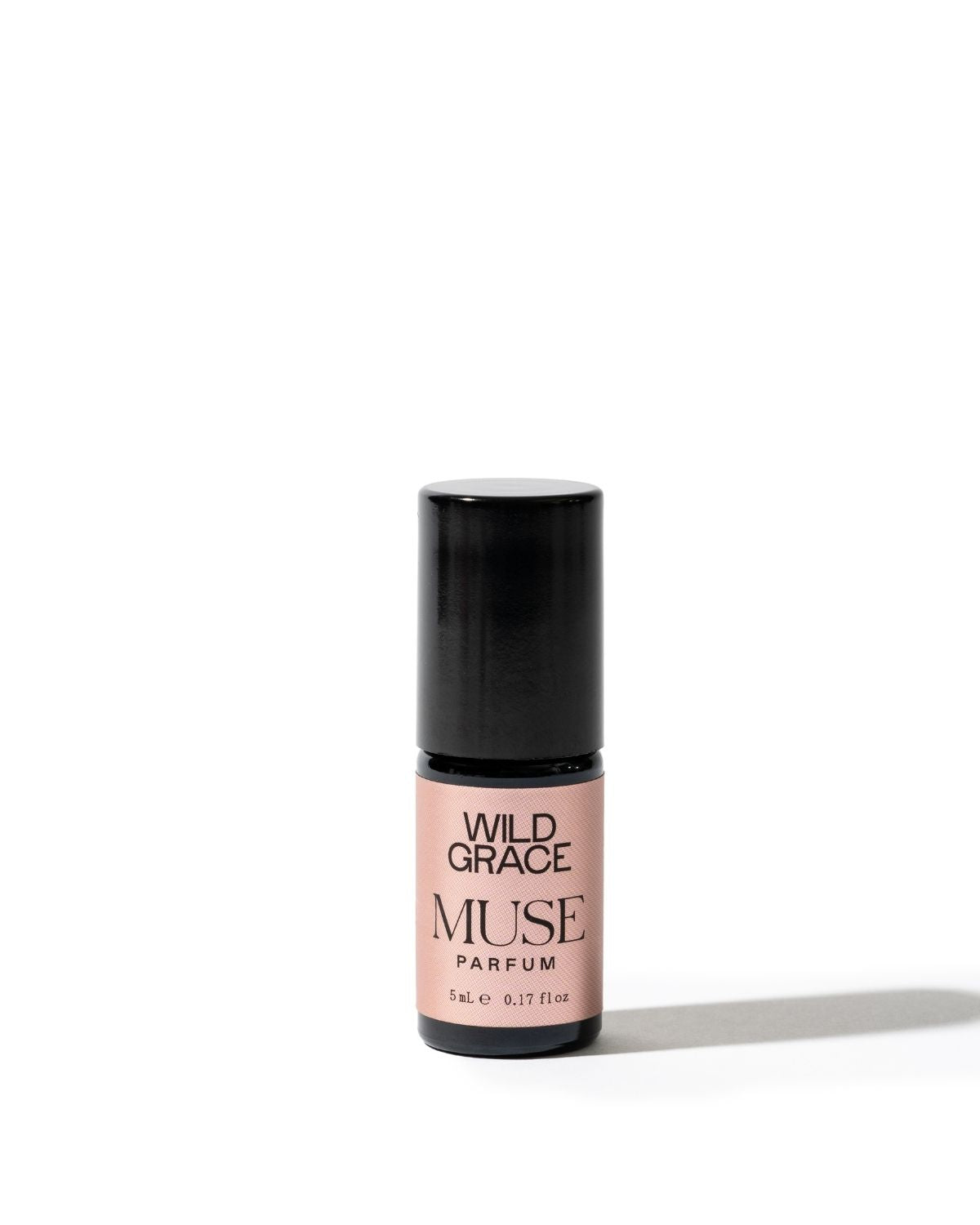 Perfume bottle labeled 'Wild Grace Muse' on a white background