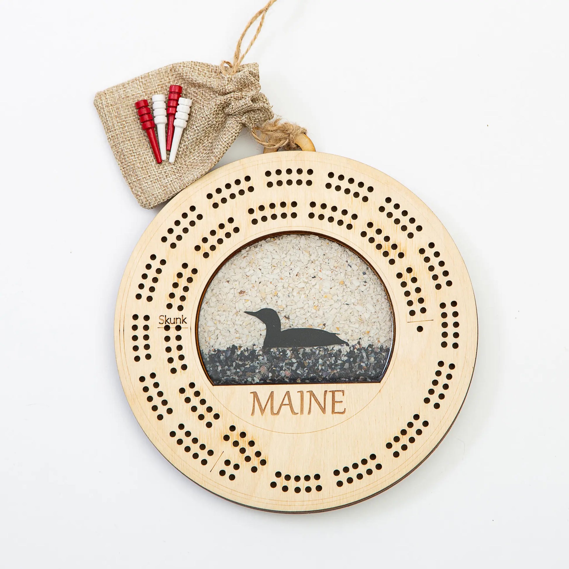 Maine Shellware Cribbage board featuring a Maine loon design with crushed shell inlay on polished wood surface.