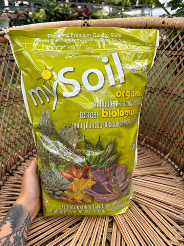 Bag of mySoil organic fertilizer on a woven surface