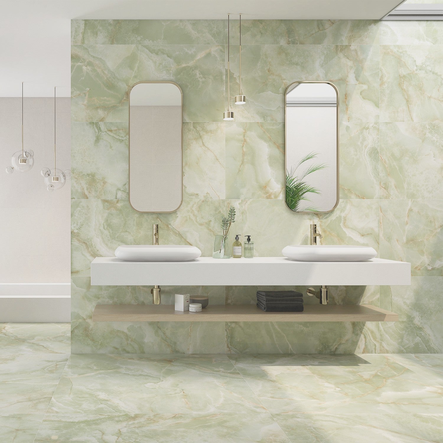 Interior space featuring walls and floors adorned with green marble effect tiles, with a modern bathroom vanity and mirrors.

layout-bathroom