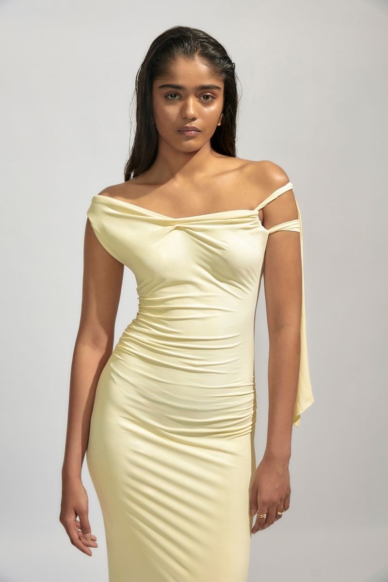 Yellow maxi dress by Deme By Gabriella featuring a flowing silhouette and elegant design, perfect for summer occasions.