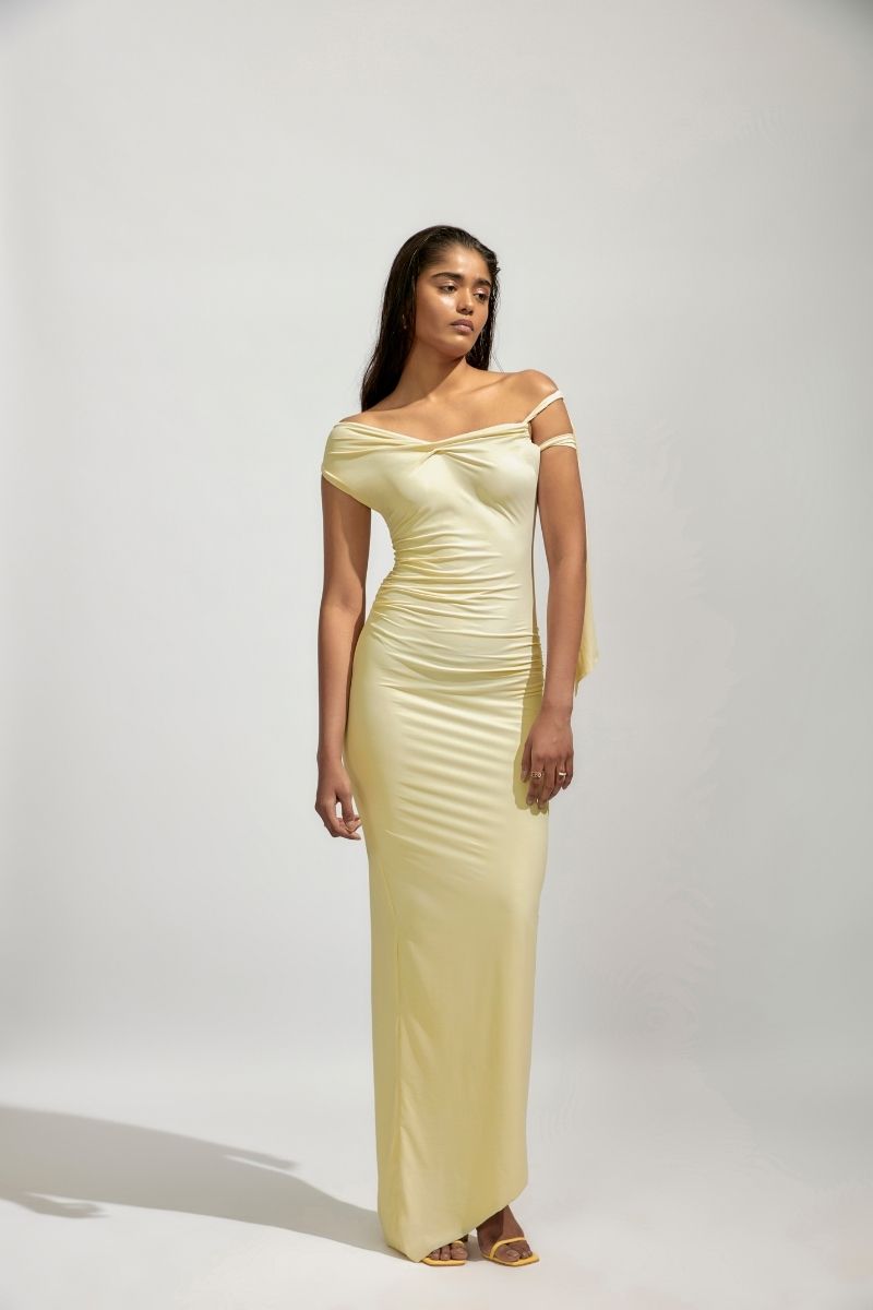 Yellow maxi dress from Deme By Gabriella, featuring a flowing silhouette and stylish design, perfect for summer or special occasions.