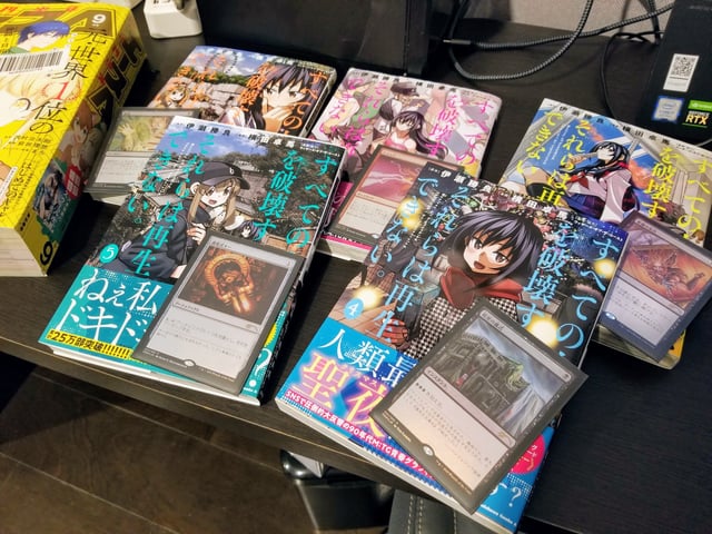 All 5 currently published volumes of "Destroy All Humankind, They Can't Be Regenerated" with the promo foil cards that came with each : r/manga