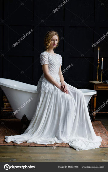 Woman in long white dress — Stock Photo © smmartynenko #147037039