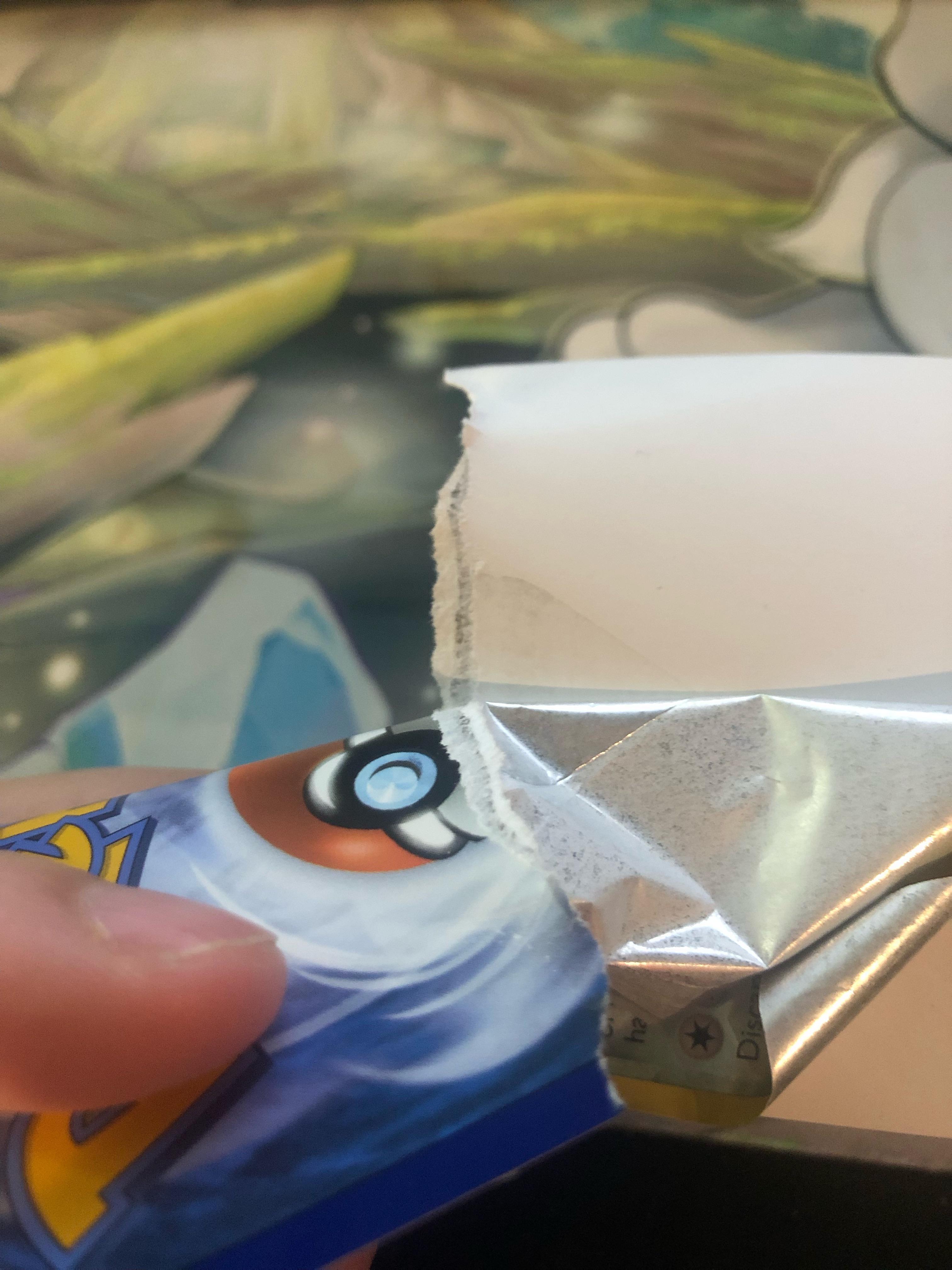 Fake card?!? Just for fun I decided to rip this reverse holo ambipom cuz I have to many of them and instead of ripping it peeled off like a sticker I got