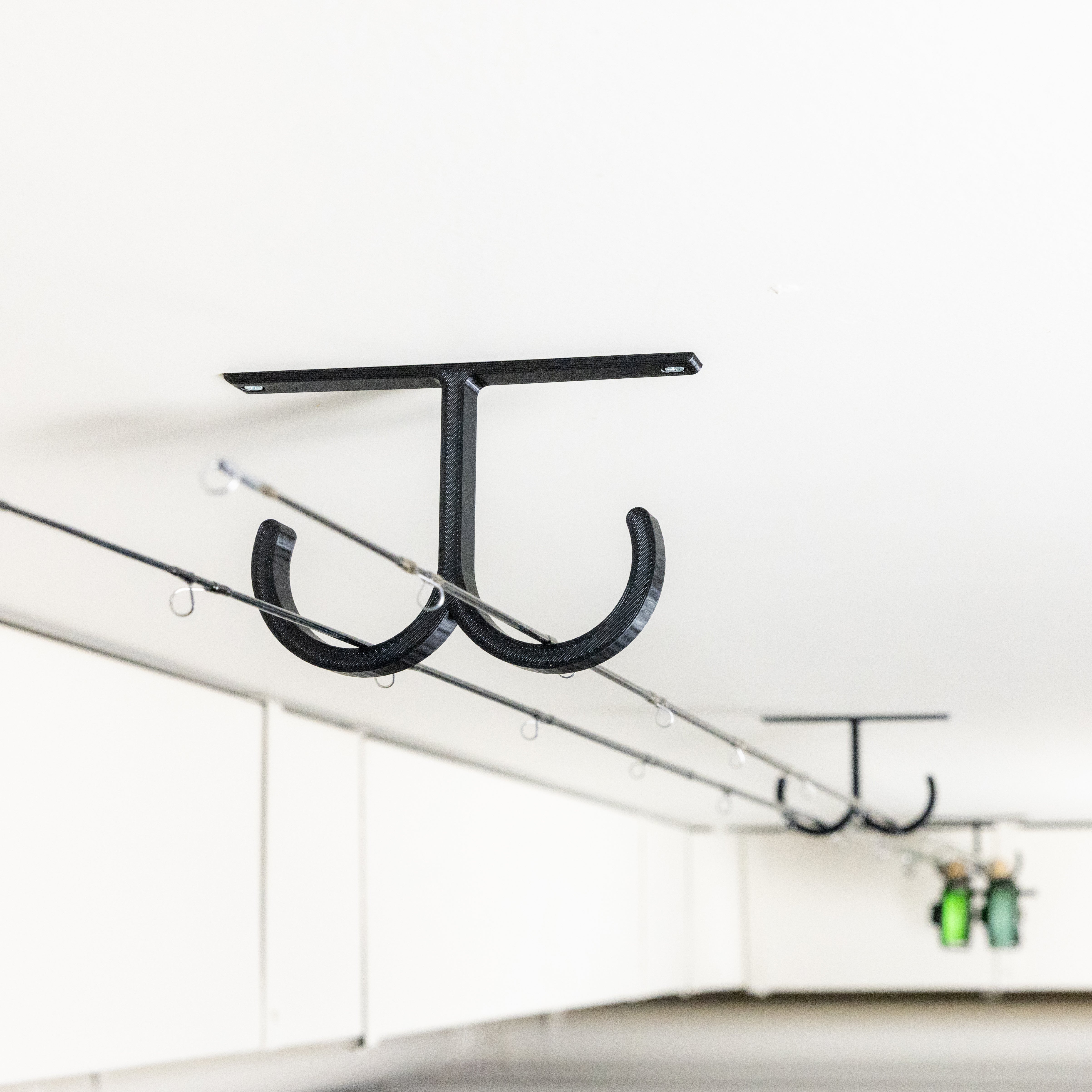 The Fishing Rod Holder Double Ceiling by Pesca Innovations allows you to store any of your fishing rods on a ceiling.