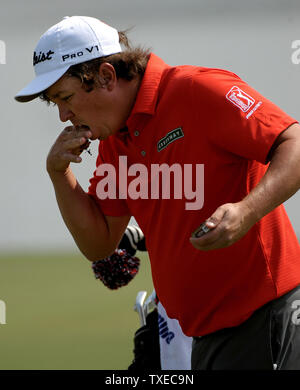 Jason Dufner slips some chewing tobacco into his mouth during practice for the PGA Tour Championship on September 17, 2013 at East Lake Golf Club in Atlanta. The 30 top players are