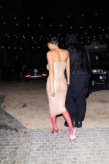 Bianca Censori wears completely sheer tube dress and knee-high stockings for Kanye West outing