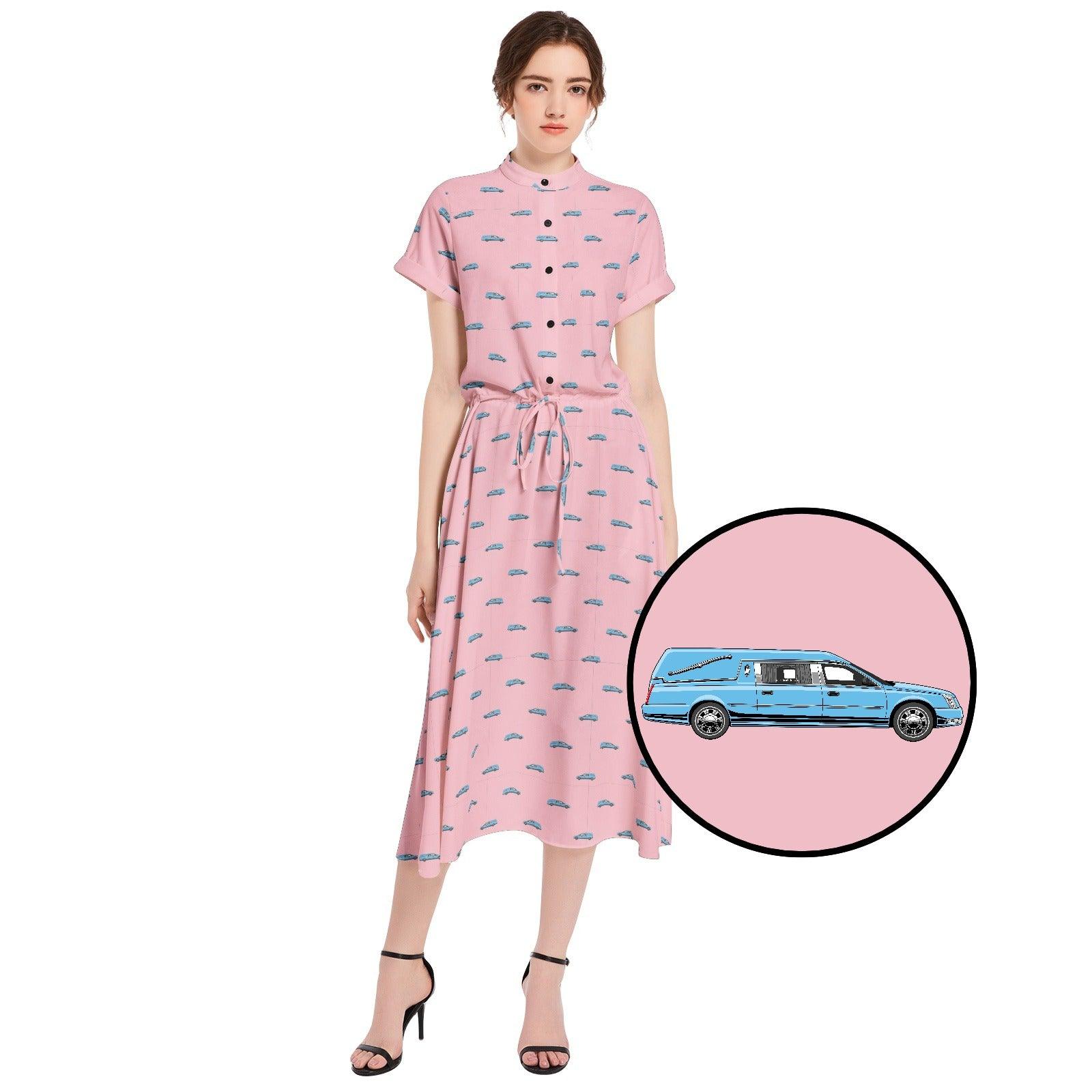 girl wearing long light pink dress with light blue funeral hearse pattern