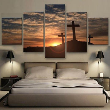 Canvas wall art with three silhouetted crosses on a hill under a dramatic sunset sky in 5 Panel and Extra Large size