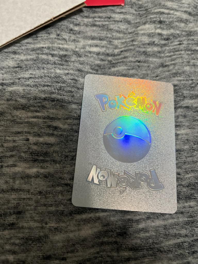 My kid's friend has this card and I've never seen one like it before. It is real? Some type of special promo? Just a fake? Rillaboom VMAX with silver back. : r/PokemonTCG