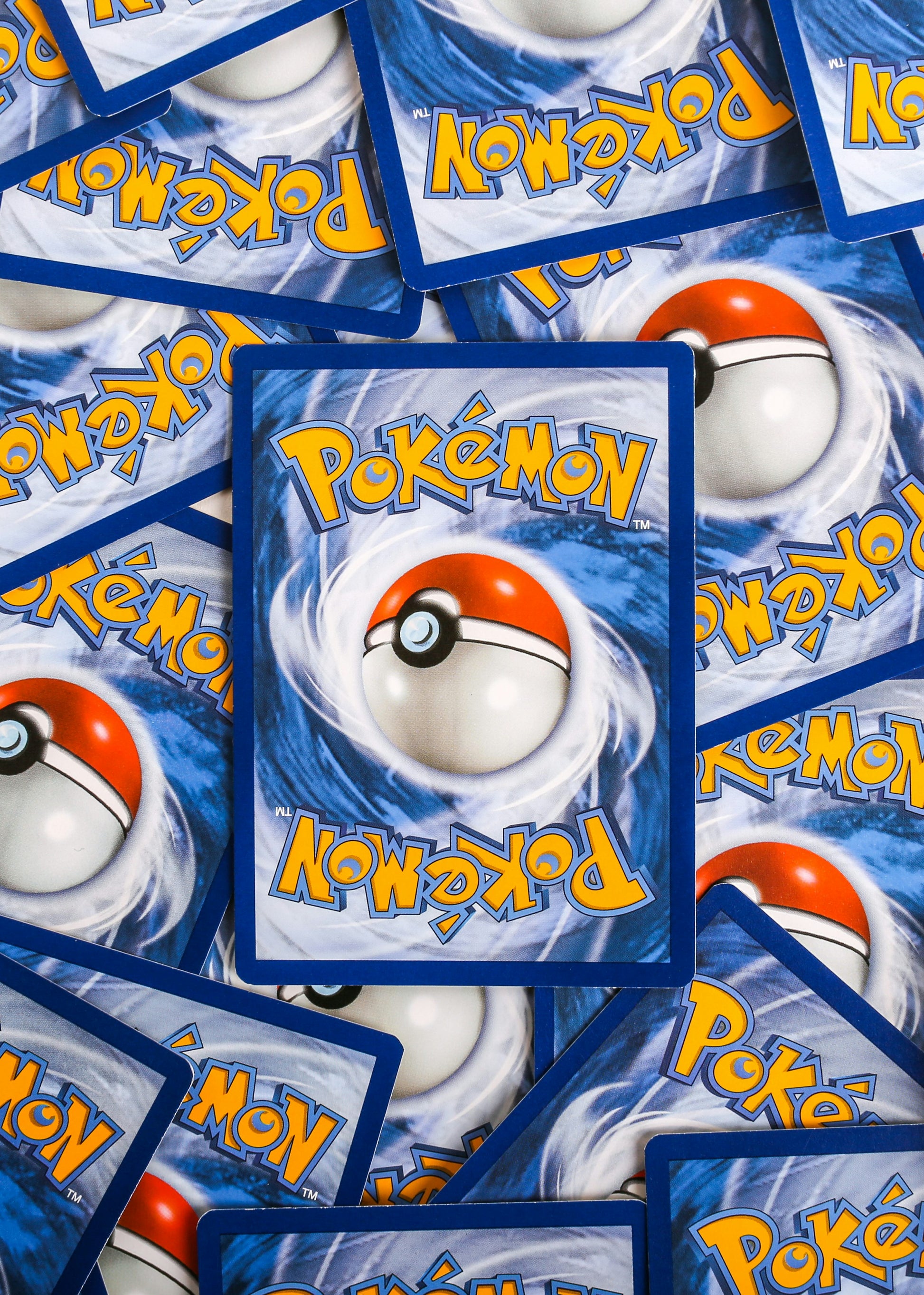 A pile of pokemon trading cards sitting on top of each other photo – Free Pokemon Image on Unsplash