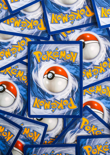 A pile of pokemon trading cards sitting on top of each other photo – Free Pokemon Image on Unsplash
