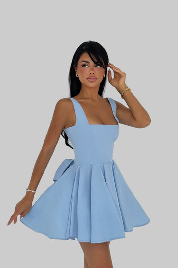 Model wearing blue bow-back skater dress with flared skirt – LARYVOE women’s clothing