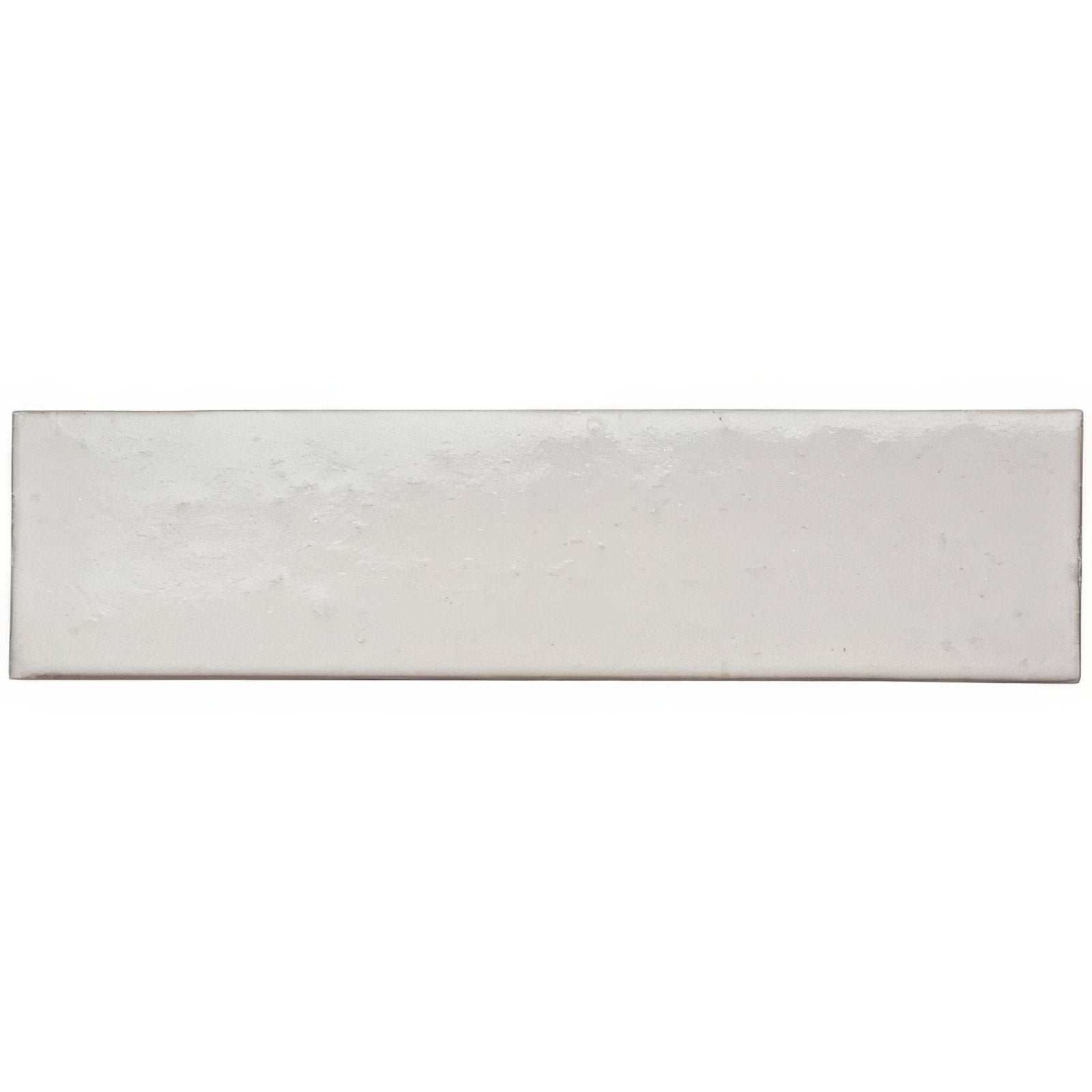 A rectangular matte-finished white ceramic sand smooth brick tile with subtle texture and slightly uneven edges