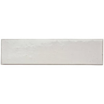 A rectangular matte-finished white ceramic sand smooth brick tile with subtle texture and slightly uneven edges