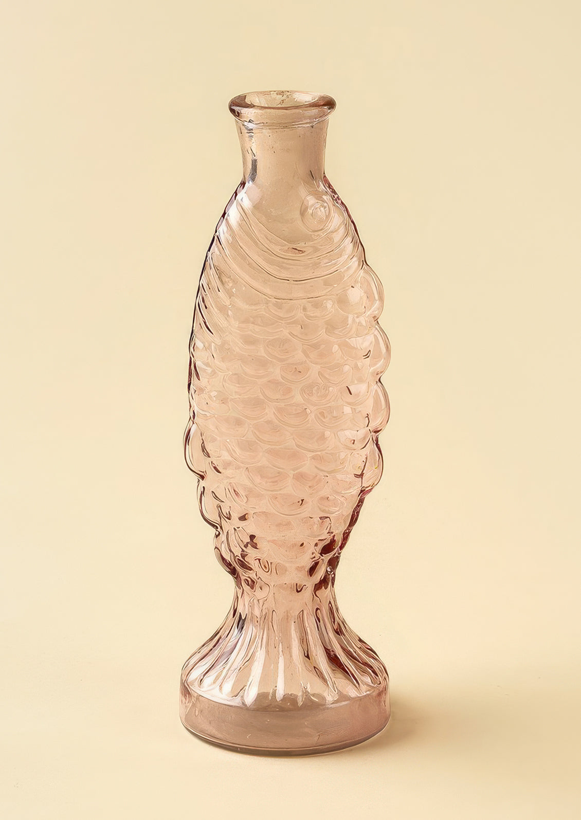 A glass vase/pitcher shaped like a fish.